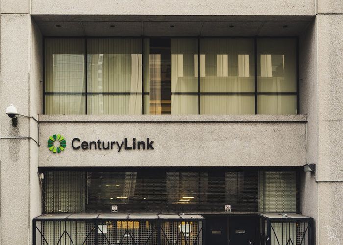 Modern office building exterior with glass facade and professional entrance